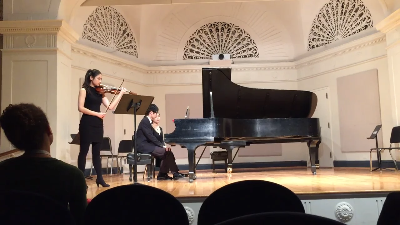Black-and-white archive still from a chamber performance recital.